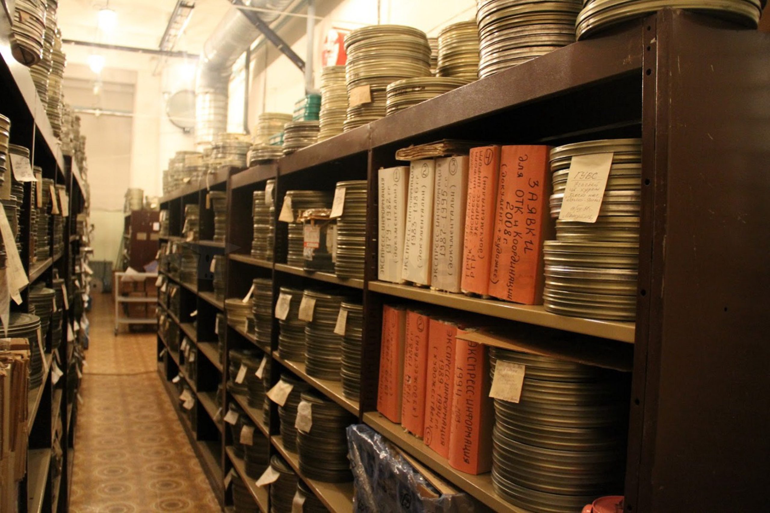 film cans on shelves inside the Russian archive